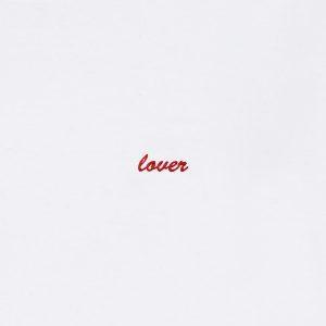 "lover" embroidered in crimson-cherry thread on a white sweatshirt: front-on close-up