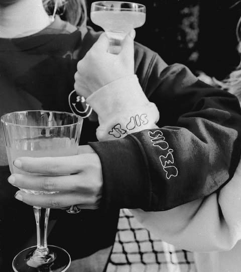 Sip-er name embroidered down a sweatshirt sleeve